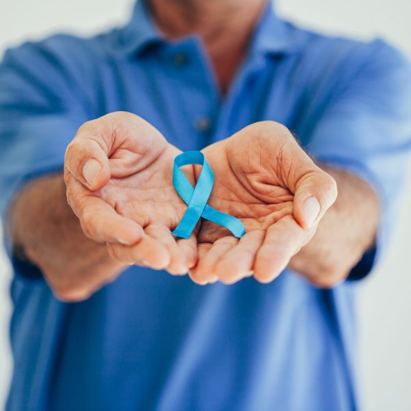 Prostate Cancer Awareness. Man with light Blue Ribbon for supporting people living and illness. Men Healthcare and World cancer day concept